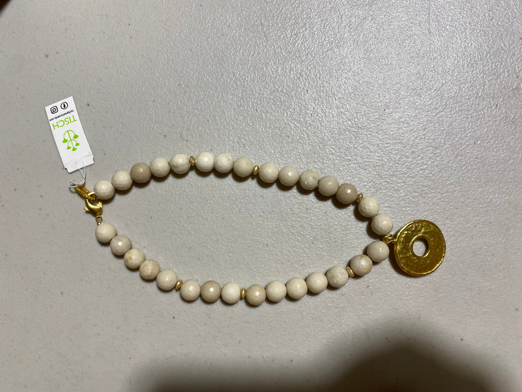 white beaded necklace w/ gold circle