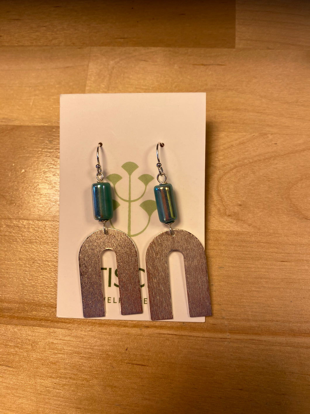 Silver horseshoe dangle earrings w/ aqua pearl